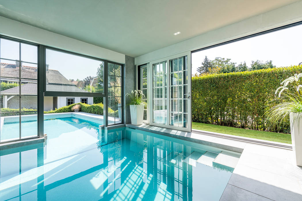 PROJECT VVG - UITBREIDING VILLA MET BINNEN-BUITENZWEMBAD TE EDEGEM, ICONcept ICONcept Piscinas rurales