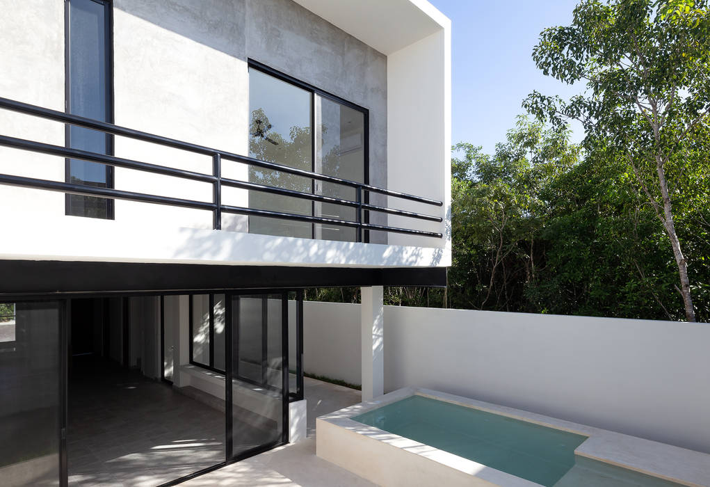 fachada posterior Daniel Cota Arquitectura | Despacho de arquitectos | Cancún Casas pequeñas Concreto
