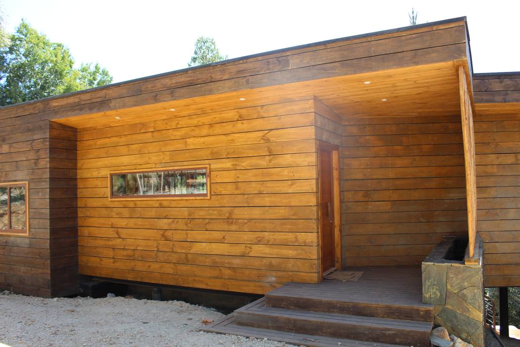 VIVIENDA EN FUNDO MILLACO, KIMCHE ARQUITECTOS KIMCHE ARQUITECTOS Wooden houses Wood Wood effect