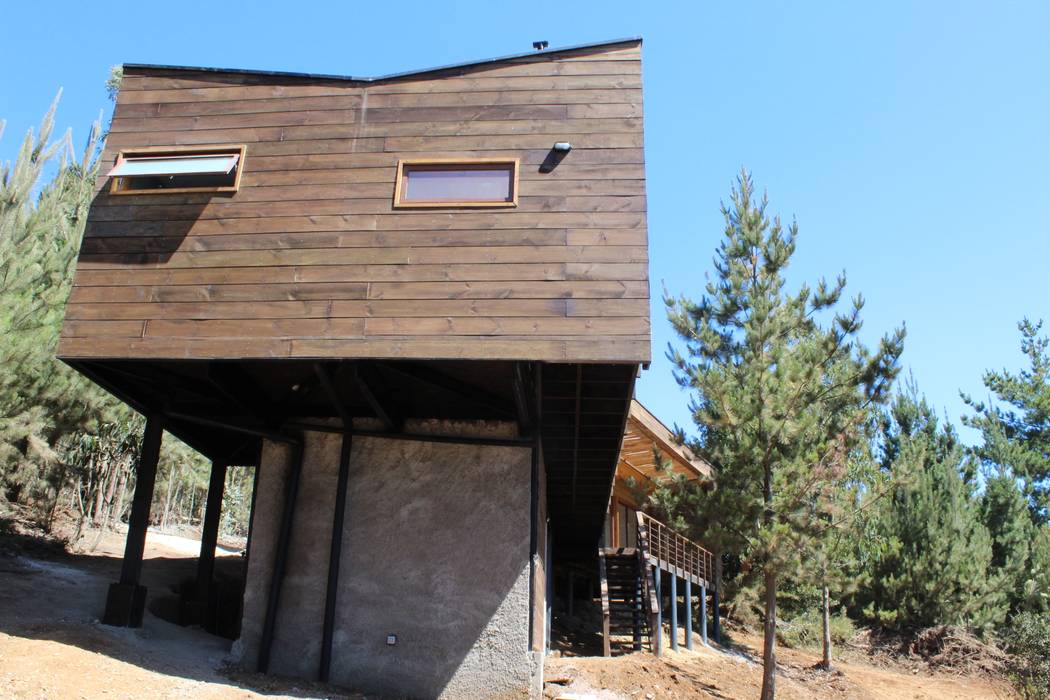 VIVIENDA EN FUNDO MILLACO, KIMCHE ARQUITECTOS KIMCHE ARQUITECTOS Casas de estilo minimalista Madera Acabado en madera