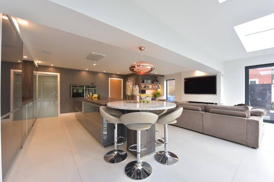 Mr & Mrs O'Hare Diane Berry Kitchens Built-in kitchens Glass breakfast bar,round bar,stools,pendant lights,tv wall,desk,neff