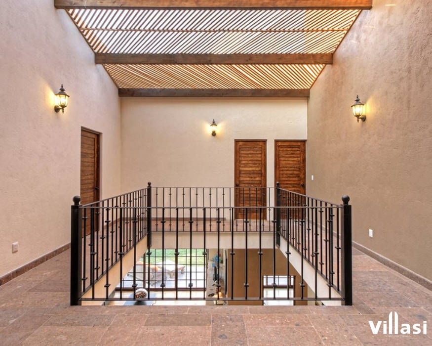 Casa Cantera en San Miguel de Allende, VillaSi Construcciones VillaSi Construcciones Rustic style corridor, hallway & stairs