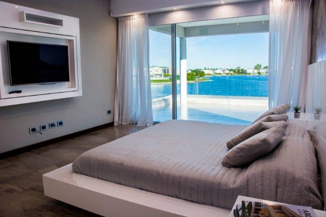 Casa La Reserva Cardales: Dormitorios de estilo  por ARQCONS Arquitectura & Construcción