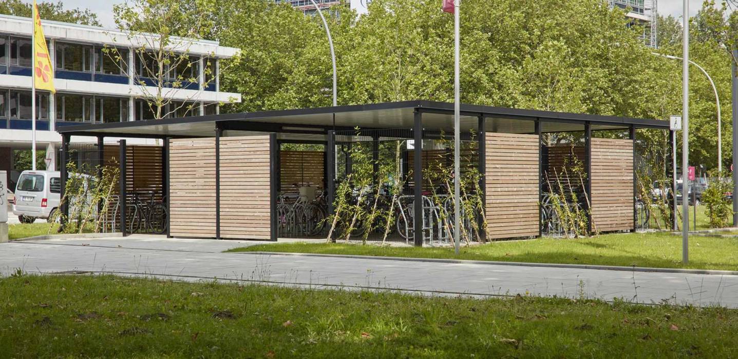 Fahrradeinhausung, Fahrradüberdachung mit Raucherlounge, projekt w – Systeme aus Stahl GmbH projekt w – Systeme aus Stahl GmbH Espacios comerciales Madera Acabado en madera Edificios de oficinas