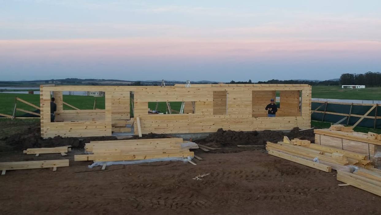 Proceso de construcción Patagonia Log Homes - Arquitectos - Neuquén Casas de estilo rústico