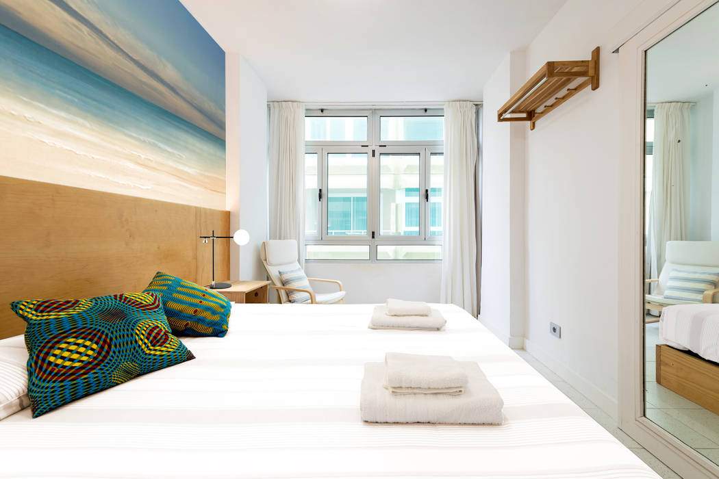 Reforma de vivienda vacacional, Sorimba Beach, SMLXL-design SMLXL-design Minimalist bedroom
