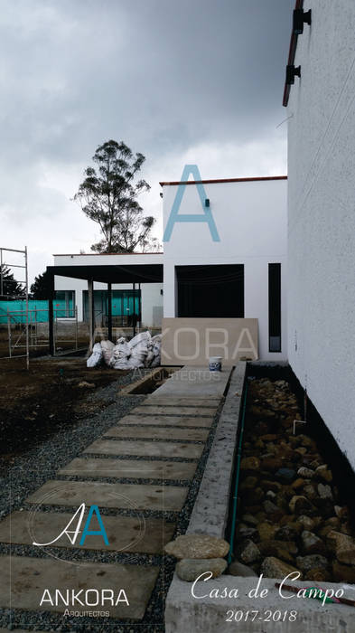 acceso principal ANKORA ARQUITECTOS Casas campestres Concreto acceso