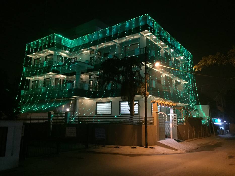 Elevation in Green LED Shade! homify Bungalows
