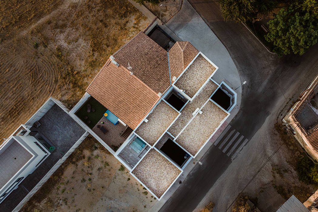 Casa en Toledo, con cuatro patios. OOIIO Arquitectura Tejados planos Piedra cubierta plana,casa moderna,patio,arquitectos Madrid