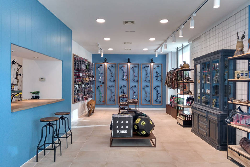 Diseño de una tienda de caza rompiendo cánones, CARMITA DESIGN diseño de interiores en Madrid CARMITA DESIGN diseño de interiores en Madrid 상업공간 우드 우드 그레인 상업 공간