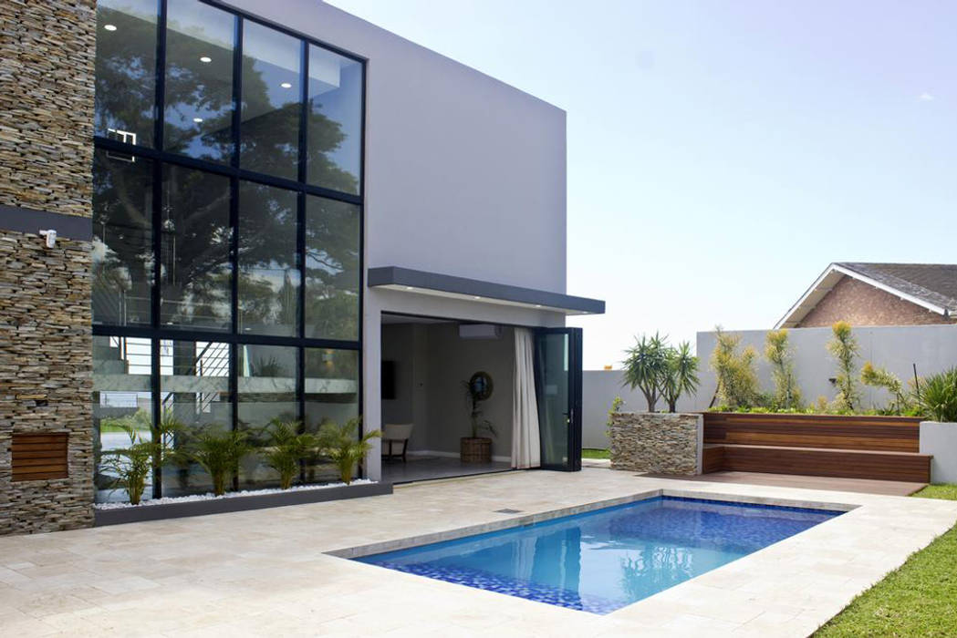 Pool Area and Back of building facade Barnard & Associated Architects Ltd Garden Pool