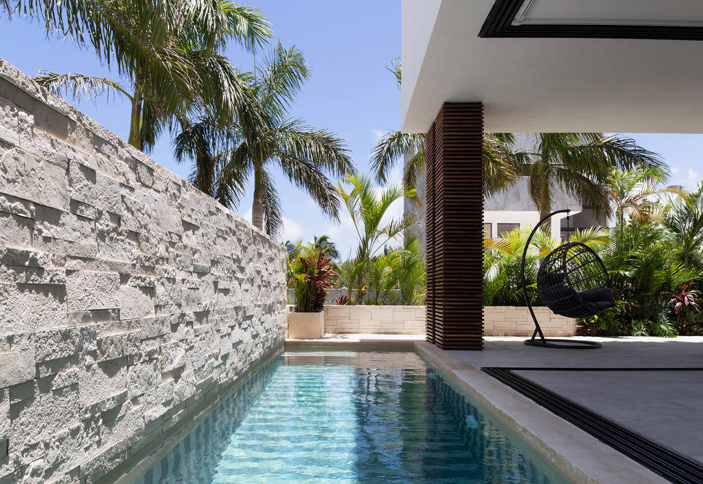 casa de la p, Daniel Cota Arquitectura | Despacho de arquitectos | Cancún Daniel Cota Arquitectura | Despacho de arquitectos | Cancún Modern pool Stone