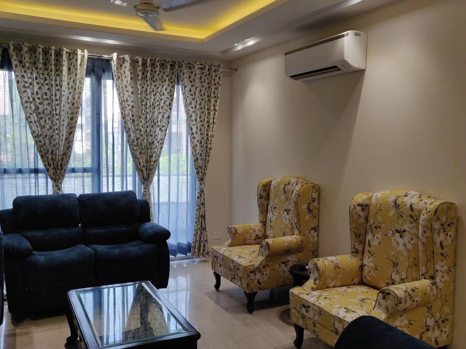 Living Room with 4 seater Sofa, 2 seater recliner, 2 seater Couch and 2 wing chairs along Design Kreations Modern living room Furniture,Property,Couch,Building,Comfort,Lighting,Window,Yellow,Interior design,Curtain