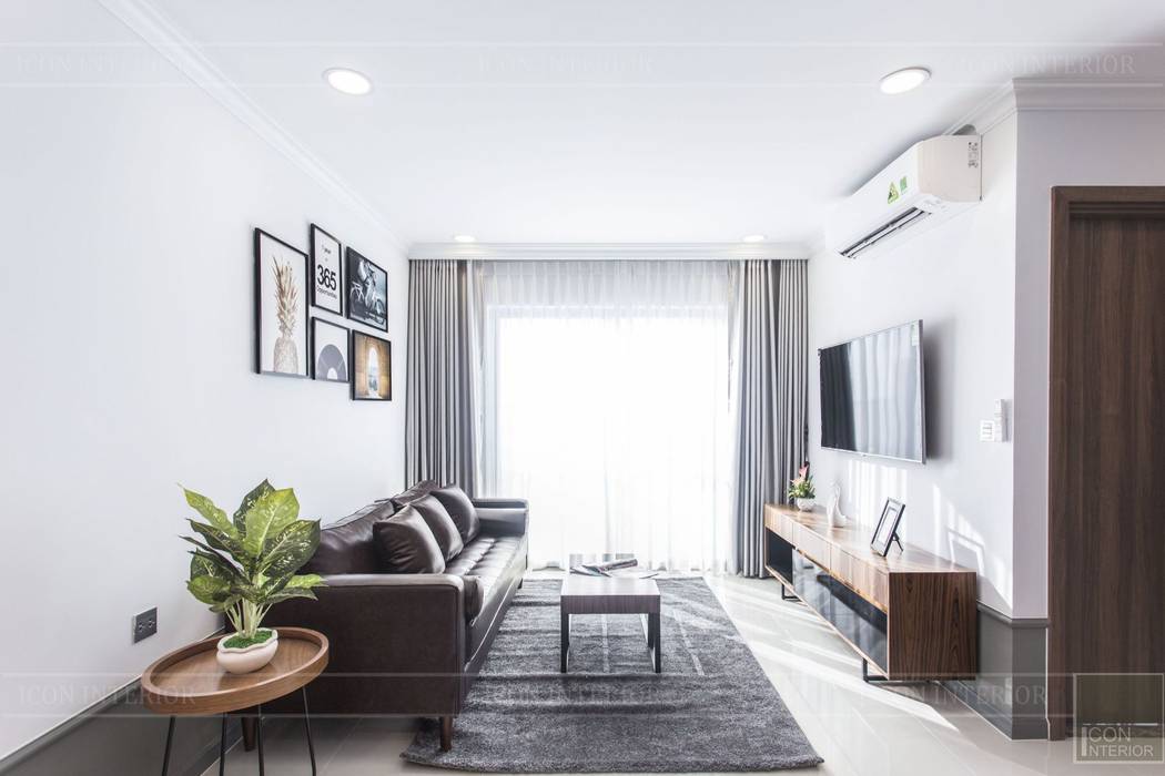 Thiết kế thi công nội thất chung cư 70m2 ấm cúng đáng mơ ước, ICON INTERIOR ICON INTERIOR Salas modernas