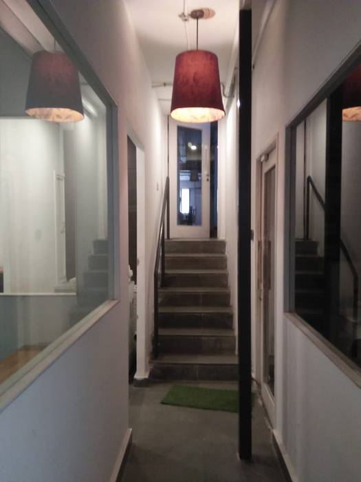 Corridor with simple hanging light Grey-Woods Minimalist corridor, hallway & stairs Granite