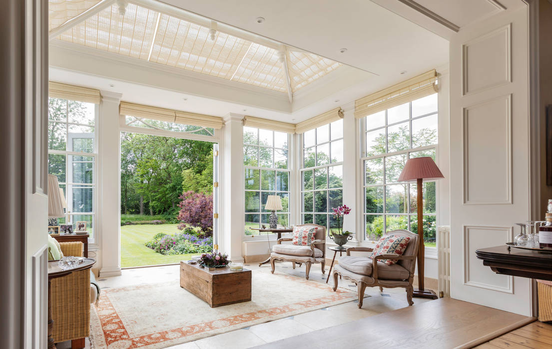 Interior view of a beautiful orangery looking out to the garden Vale Garden Houses Classic style conservatory Wood Wood effect