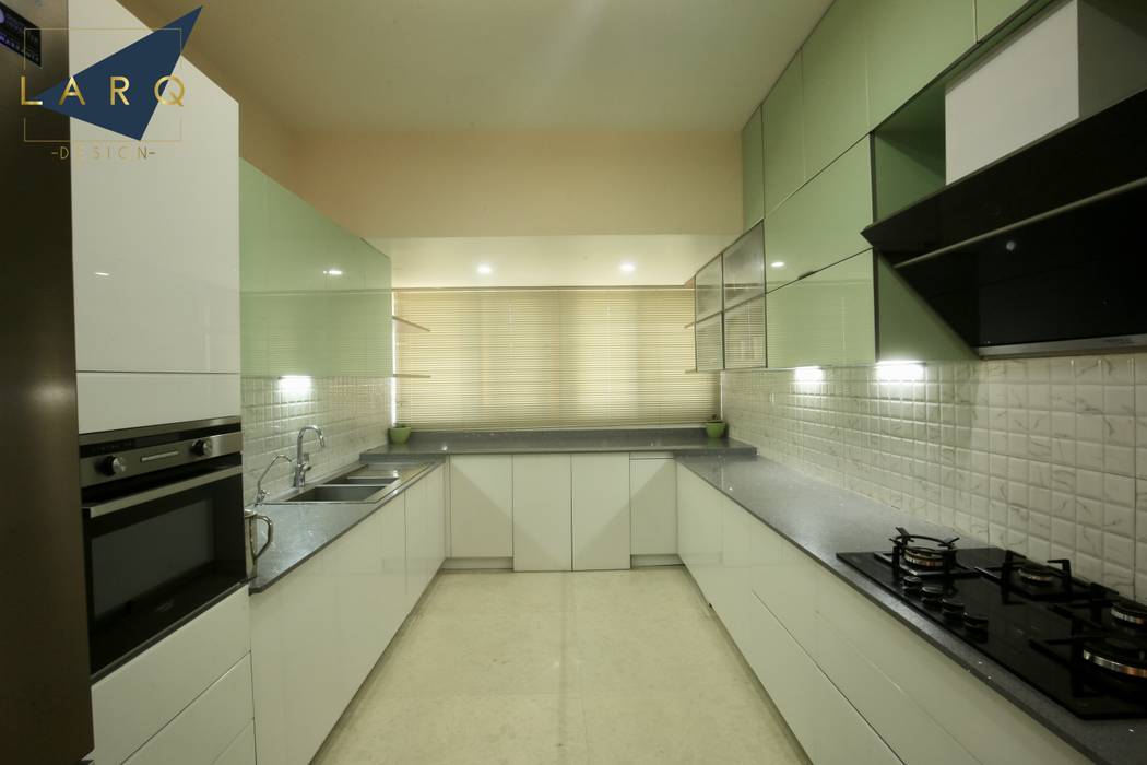 Kitchen with lacquered glass shutters larq design pvt ltd modern