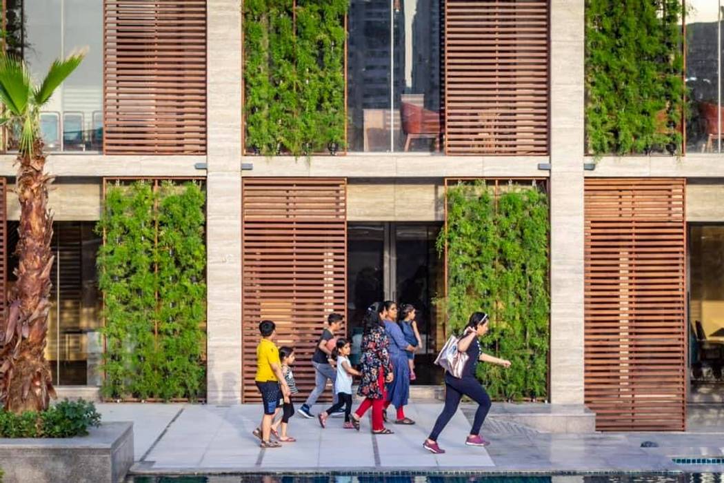 Clubhouse for Housing Community - A Sustainable Architecture Design, Basics Architects Basics Architects Dinding & Lantai Modern