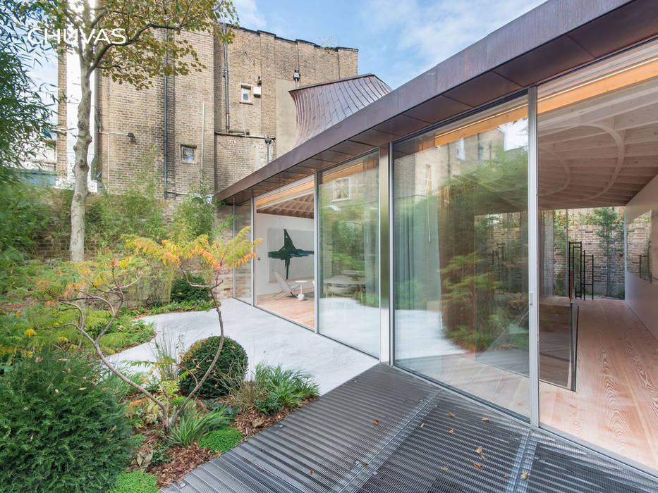 fachada para o jardim CHUVAS arquitectura Jardins de fachadas de casas