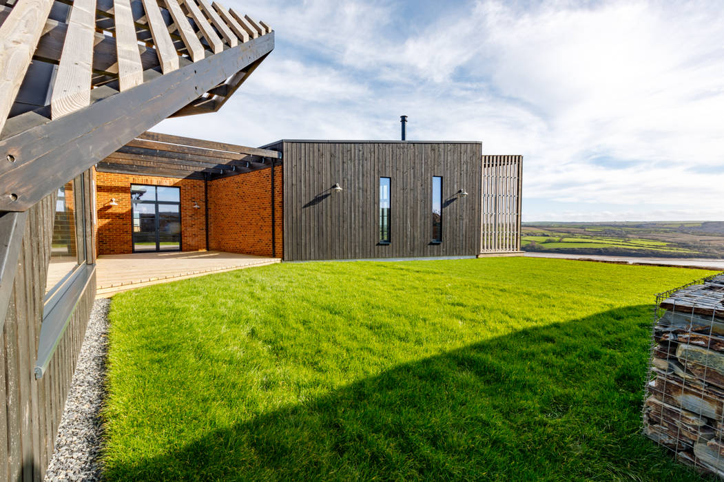 Secluded patio leading onto garden Arco2 Architecture Ltd Front yard Eco friendly home, sustainable home, environmentally friendly home, cornish architects, architects Cornwall, sustainable architects,