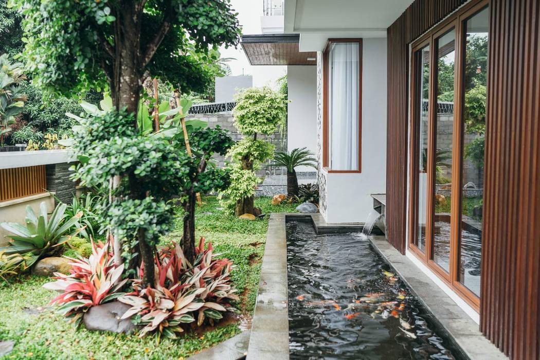 Project Renovasi Rumah 2 Lantai Style Tropical modern, Studio JAJ Studio JAJ Taman Tropis
