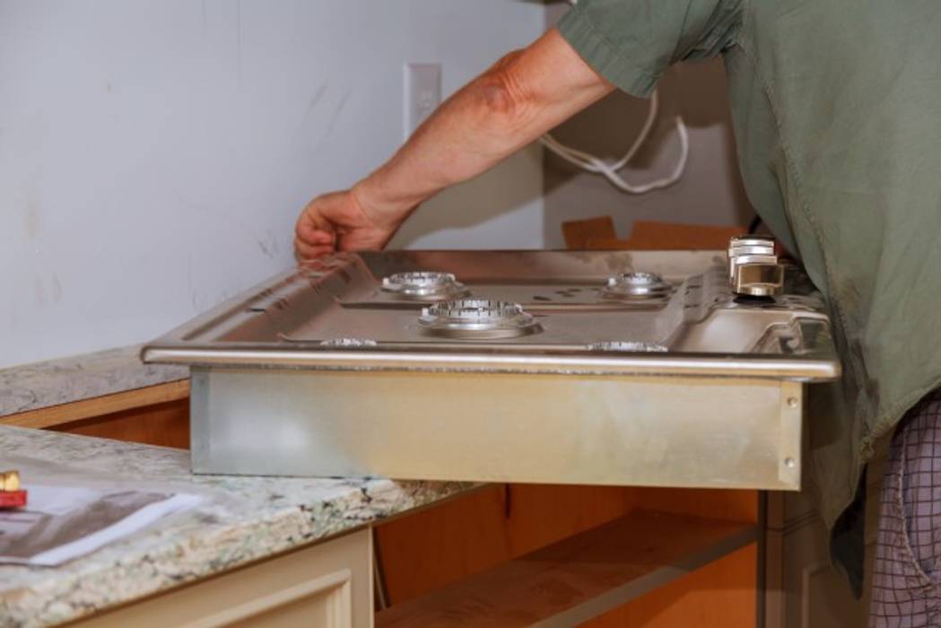 plumber putting in sink, Plumbers Network Alberton Plumbers Network Alberton Kitchen units