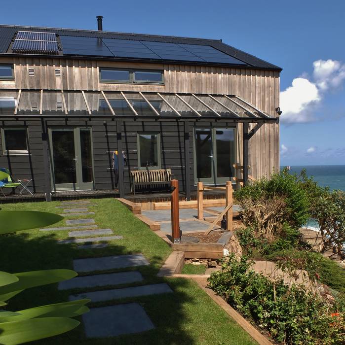 Sun terrace on a beach house in Cornwall. Arco2 Architecture Ltd Minimalist houses beach front property, beach house, seaview property, eco friendly house, sustainably built house, property Cornwall, eco home Cornwall, Wooden Home, Low impact home, passive house,