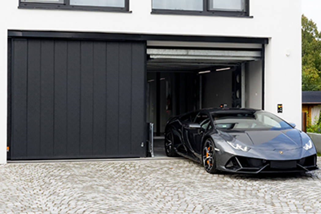 The Key For A Unique House Idealpark Car Lift Exploring A Bauhaus Villa Idealpark Srl Modern Garage And Shed Homify