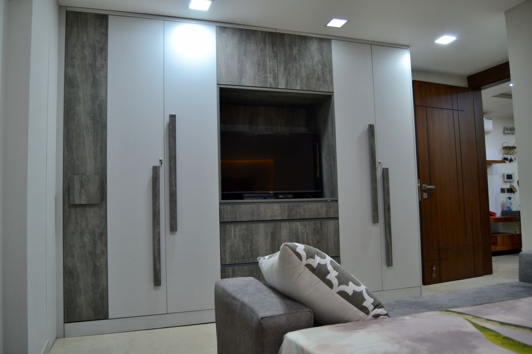 Wardrobe with integrated tv unit lakkad works modern style bedroom homify