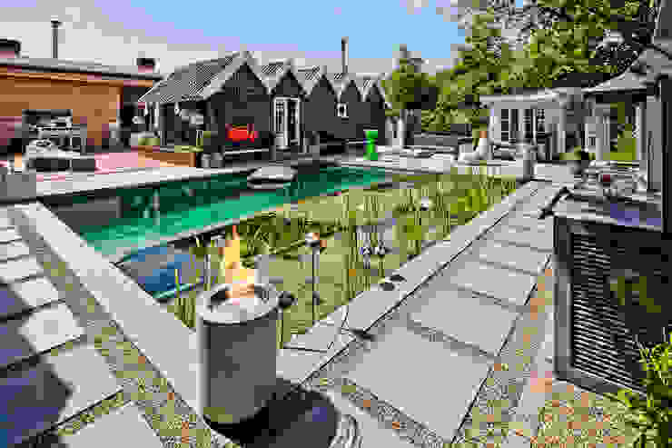 Jardins ecléticos por Planika Fires Eclético