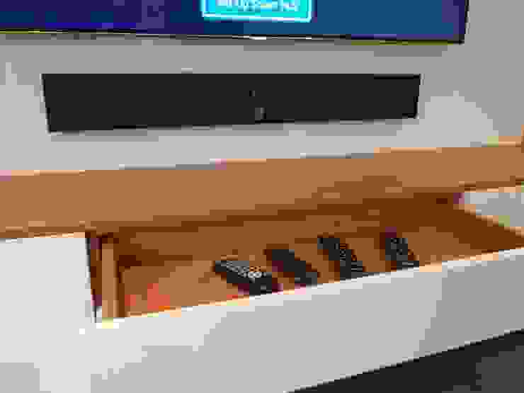 Two tone floating bespoke media and storage unit. homify