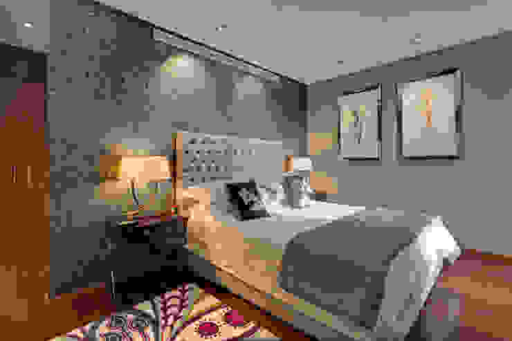 Stylish and sophisticated, a bedroom based on neutrals with a colourful bedside rug. Design by Deborah Ltd Modern style bedroom