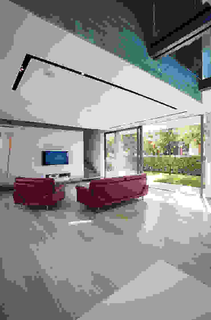 Modern living room by NAT OFFICE - christian gasparini architect Modern