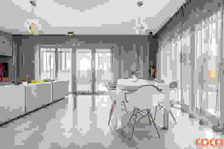 Salas de jantar minimalistas por COCO Pracownia projektowania wnętrz Minimalista