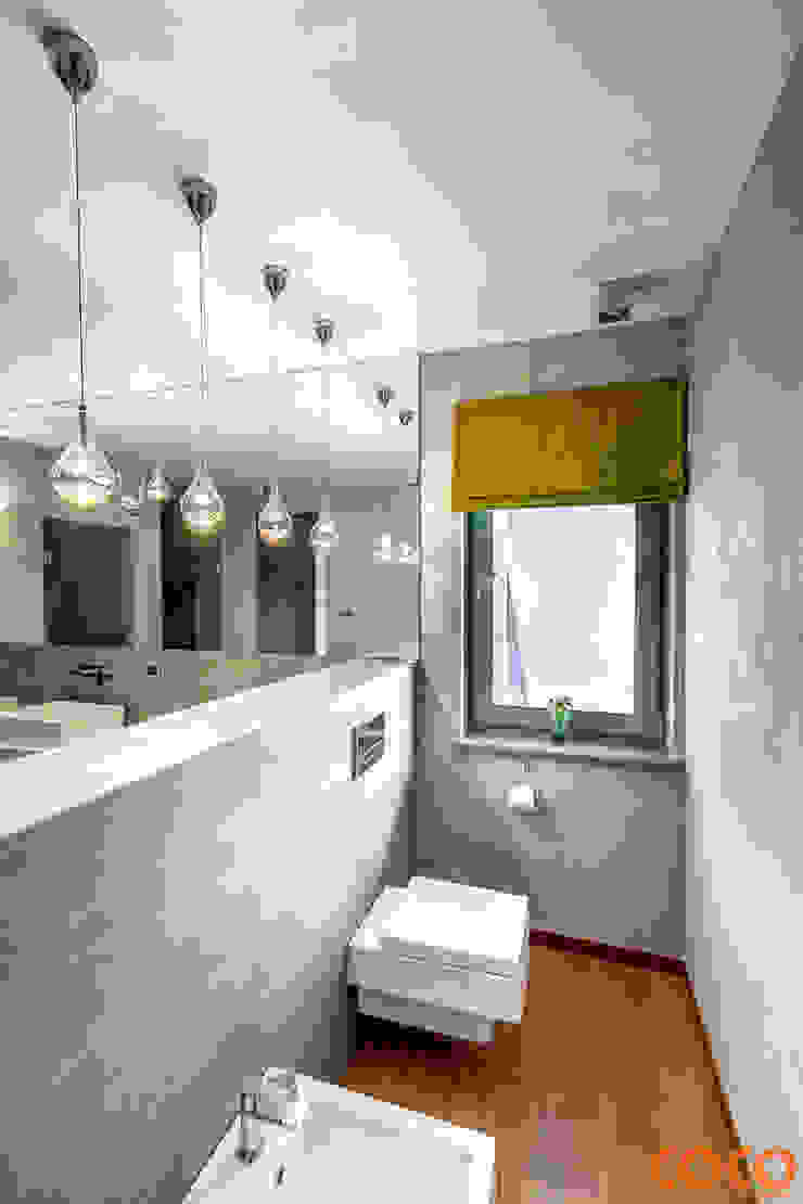 Banheiros minimalistas por COCO Pracownia projektowania wnętrz Minimalista
