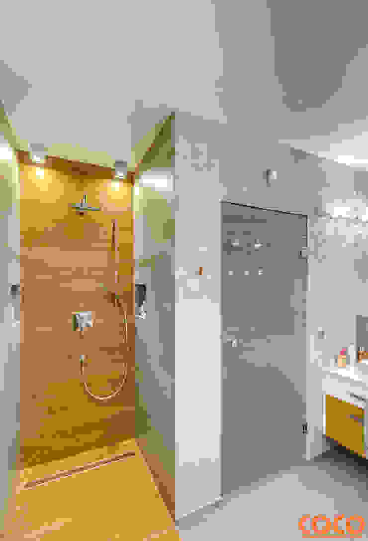 Banheiros minimalistas por COCO Pracownia projektowania wnętrz Minimalista