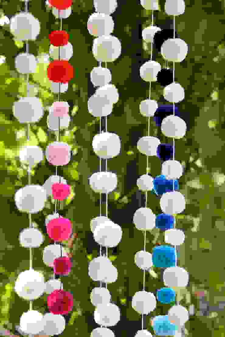 Pom Pom Garlands hanging in the garden PomPom Galore Eclectic style garden