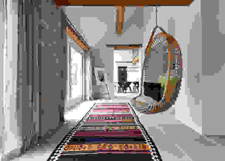 homify Rustic style corridor, hallway & stairs