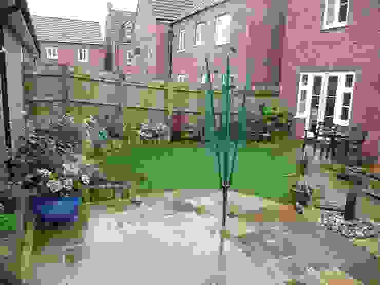 A garden with maximum interest in a small space with lawn and paved