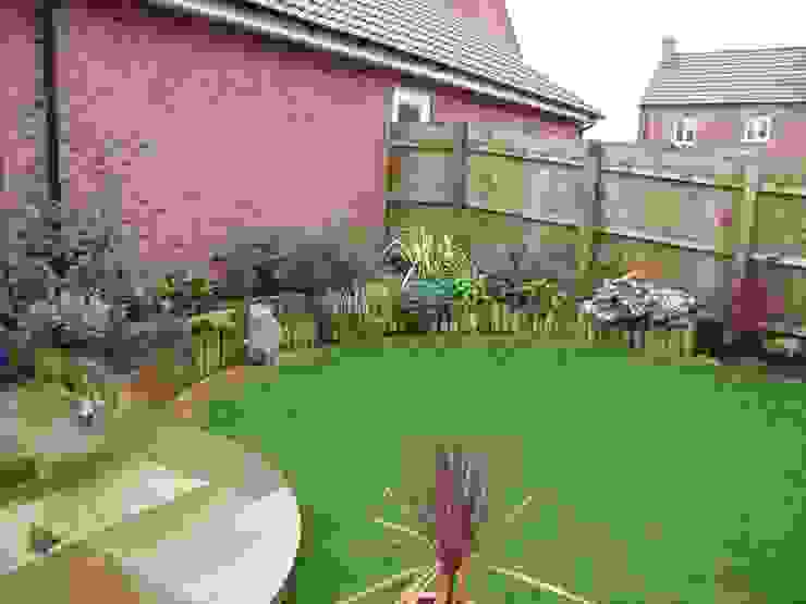 A garden with maximum interest in a small space with lawn and paved