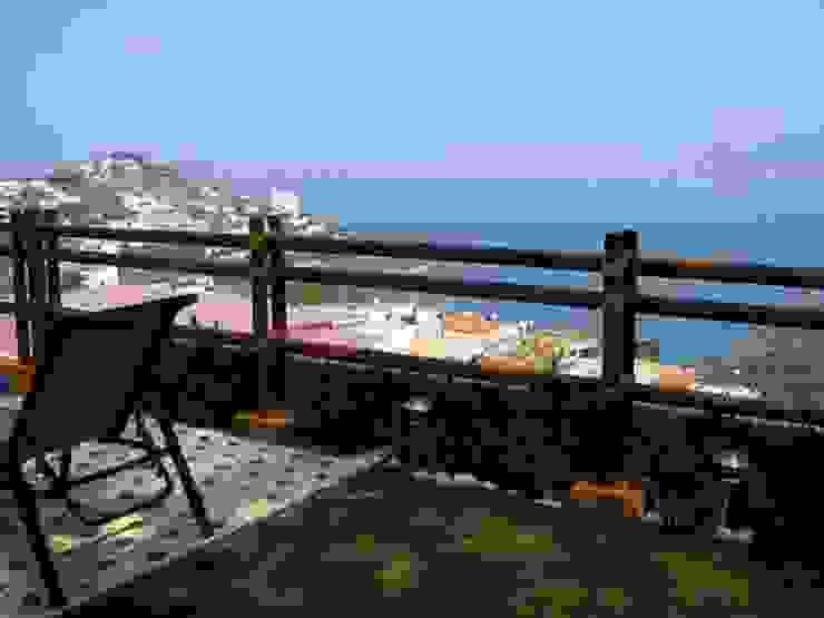 ARQUELIGE Balcone, Veranda & Terrazza in stile tropicale
