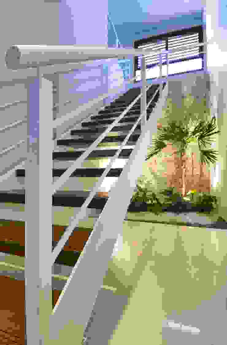 homify Tropical style corridor, hallway & stairs