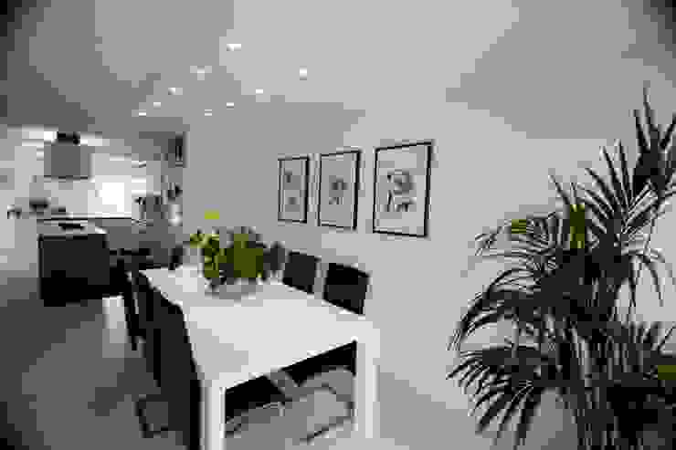 Riqualificazione e arredo casa privata, Studio HAUS Studio HAUS Modern dining room
