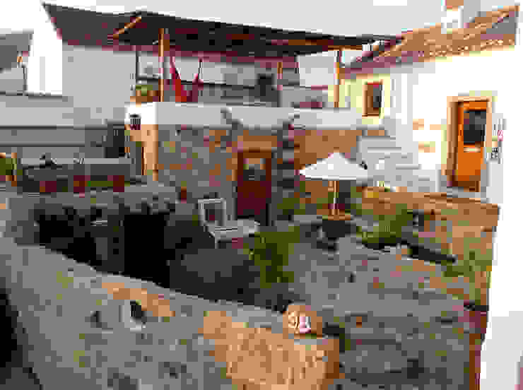 Rustic style houses by pedro quintela studio Rustic Stone