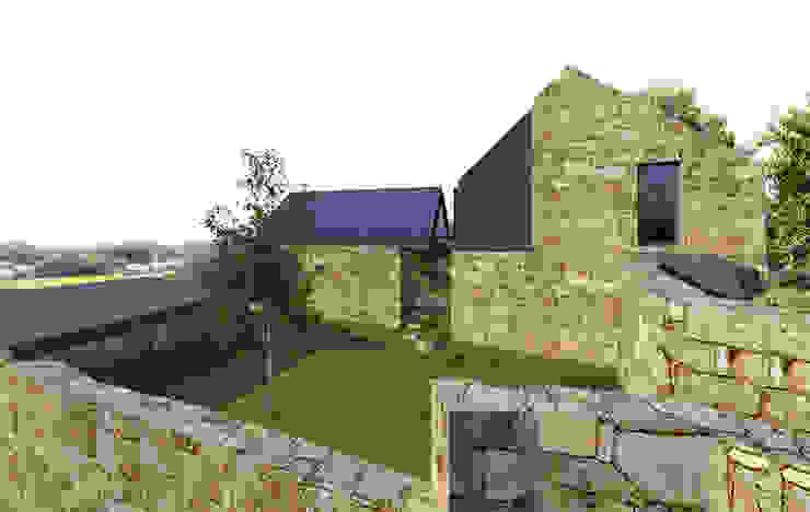 Davide Domingues Arquitecto Case in stile rustico Granito Metallizzato/Argento