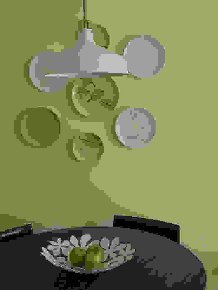 Eclectic style dining room by MUDA Home Design Eclectic