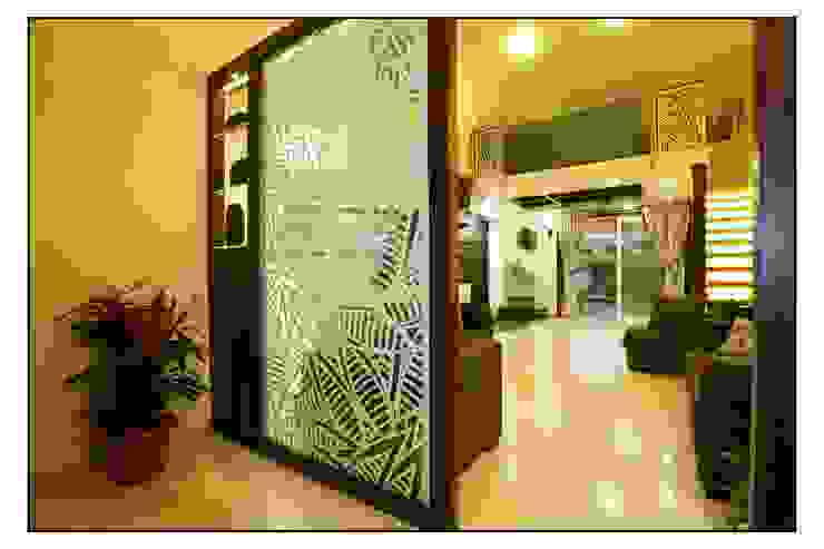 View of the Living Space from the Entrance Lobby Navmiti Designs Modern corridor, hallway & stairs Plant,Property,Furniture,Houseplant,Interior design,Building,Door,Flooring,Chair,Floor