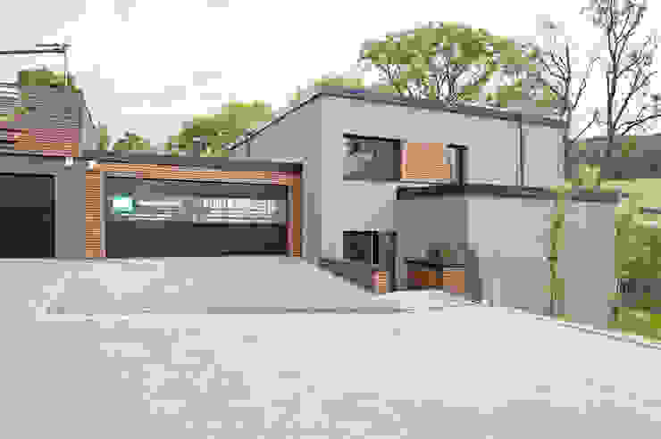 Holz trifft Beton im modernen Einfamilienhaus | homify | homify