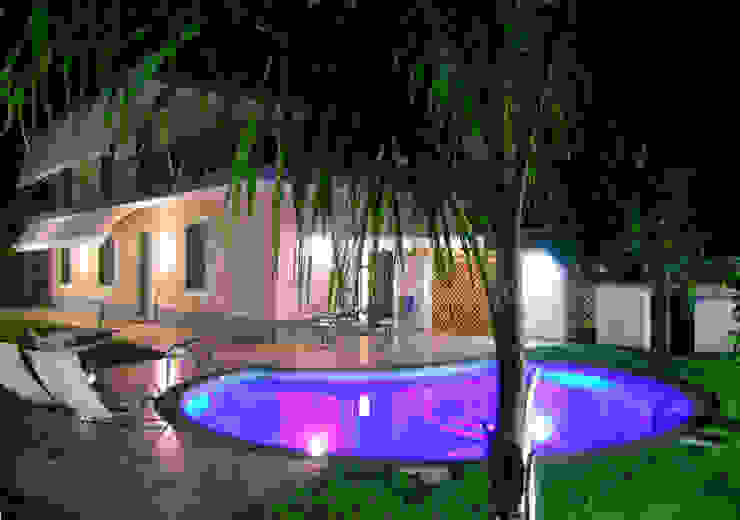 piscina Pecoramelloarchitetti Giardino moderno giardino,piscina,verde,prato