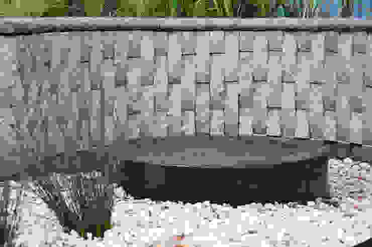 Water feature and bog garden Acton Gardens Industrial style garden Concrete Grey